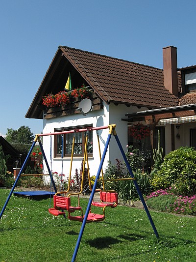 Ferienwohnung mit Balkon - Das Wohn- und Esszimmer